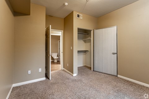 The master bedroom features a fully renovated en-suite bathroom and plush carpeting, creating a fresh and comfortable retreat.at The Hills at Quail Run, CA, 92507